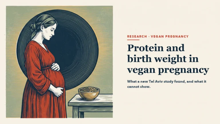 A pregnant woman in a red dress stands in profile with her hands on her belly in front of a navy circle, beside a table with a bowl of lentils and chickpeas